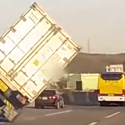 Truck almost overturns, drives on two wheels