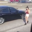 Watch woman walk in middle of busy freeway while chatting on her phone